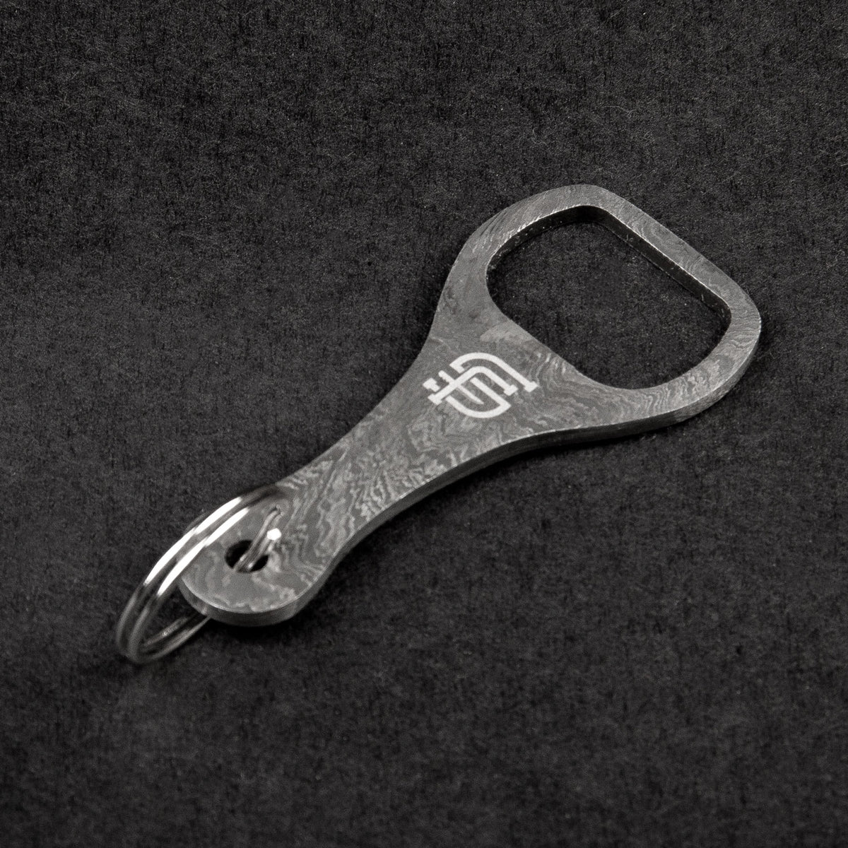 http://forsetisteel.com/cdn/shop/products/MK-68-Damascus-Steel-Keychain-Bottle-Opener-02__13173_1200x1200.jpg?v=1608239794