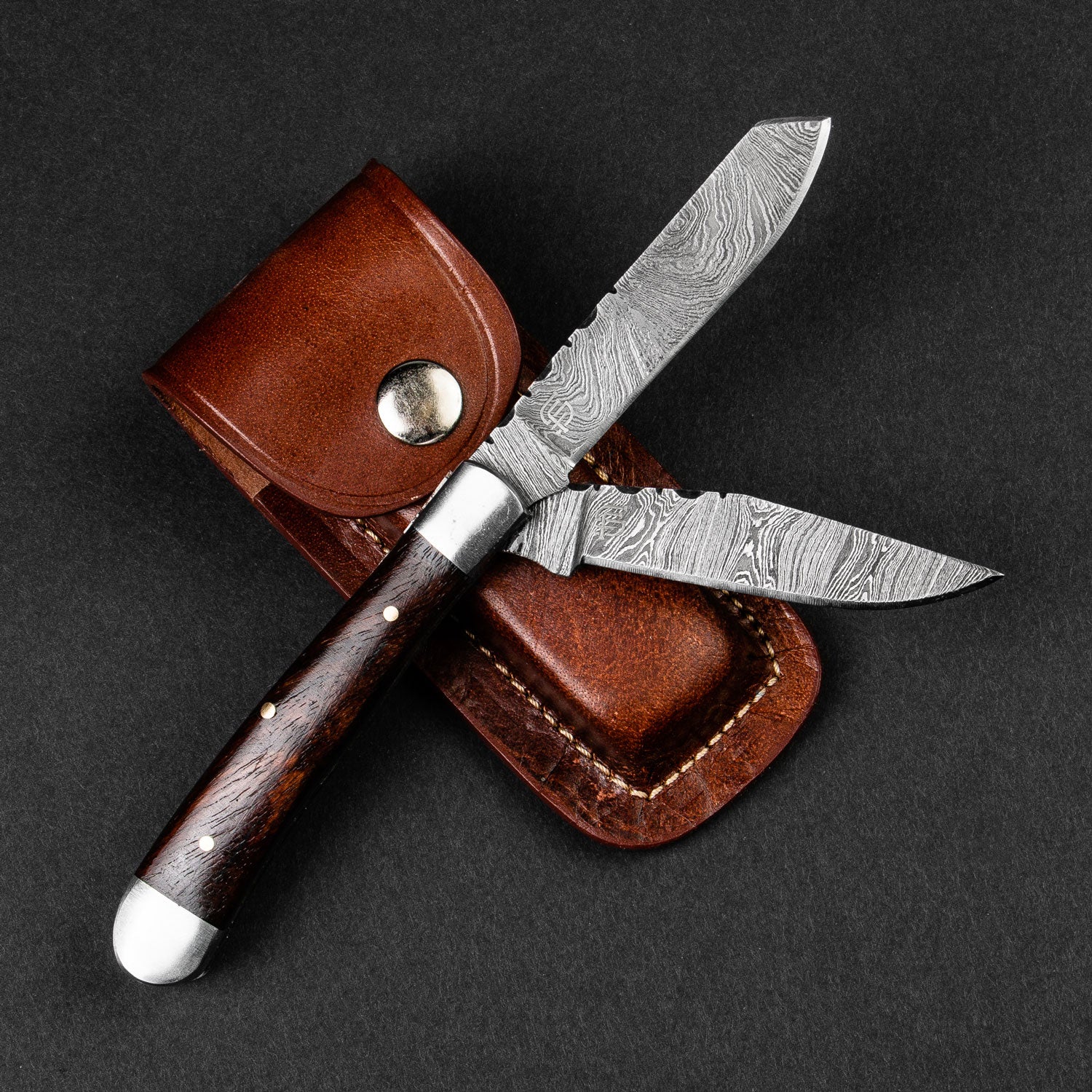 https://forsetisteel.com/cdn/shop/products/FS-1884-Falcon-Damascus-Double-Blade-Folding-Knife-01_1800x1800.jpg?v=1651271200